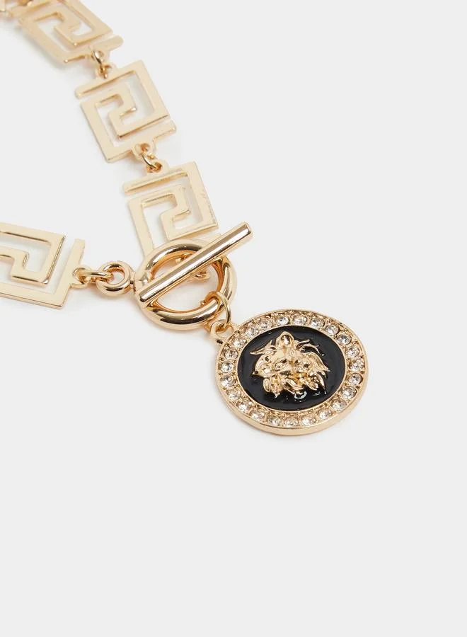 Gold Tone Meander Link Bracelet with Medallion Charm